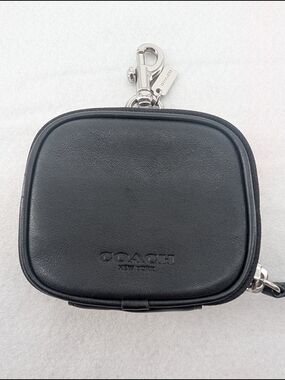 Coach Clip On Pouch featuring an embossed logo and a silver-tone